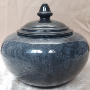 Exquisite ebony black marble trinket box with a polished finish and intricate lid design.